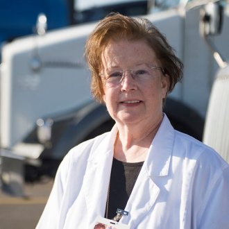 Patricia Smith, NP, stands in front of the Pilot Flying J UrgentCare Travel clinic in Knoxville, Tenn.
