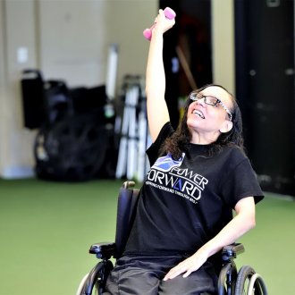 Exercise builds stronger muscles and empowers program participants. Photo credit: Monica Sempek Photography,